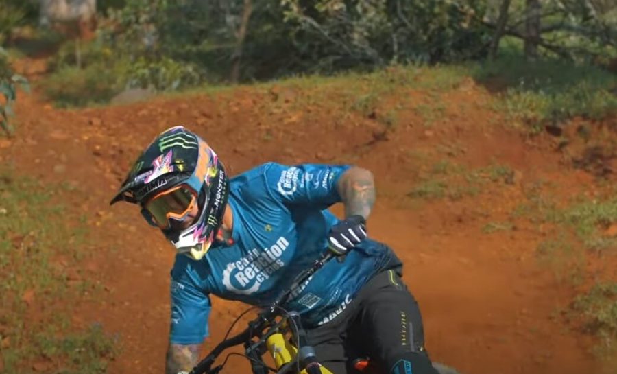 World Cup champion mountain biker Sam Hill is downhill drifting on his downhill mountain bike.